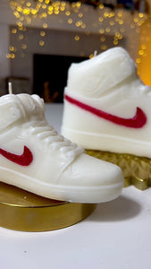 A stylish Nike Jordan 1 high-top shoe-inspired candle wax decor piece, perfect for trendy home accents and fashion-forward interior design. This limited edition collectible features iconic sneaker design elements, making it a unique and artistic statement piece. Ideal for enthusiasts of streetwear and exclusive releases, this decorative item adds flair to any space and makes for a distinctive and fashionable gift.